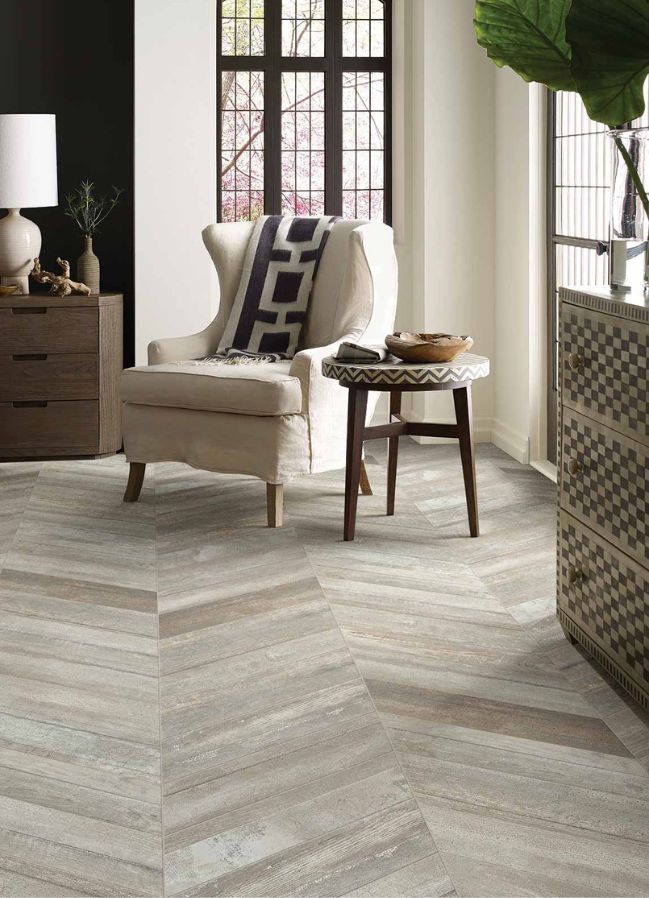 wood look tile floors in a living room with large corner windows